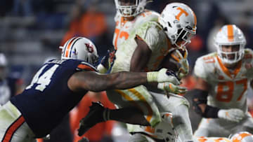 Auburn defensive tackle DaQuan Newkirk (44) gets his arms around Tennessee running back Eric Gray (3) at Jordan-Hare Stadium in Auburn, Ala., on Saturday, Nov. 21, 2020.Auburn Ut
