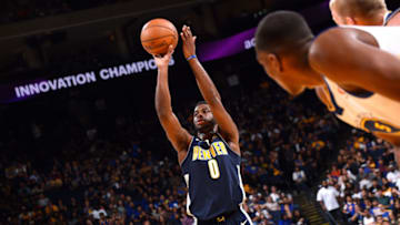 OAKLAND, CA - SEPTEMBER 30: Emmanuel Mudiay #0 of the Denver Nuggets shoots a free throw during the game against the Golden State Warriors during a preseason game on September 30, 2017 at ORACLE Arena in Oakland, California. NOTE TO USER: User expressly acknowledges and agrees that, by downloading and or using this photograph, user is consenting to the terms and conditions of Getty Images License Agreement. Mandatory Copyright Notice: Copyright 2017 NBAE (Photo by Noah Graham/NBAE via Getty Images)