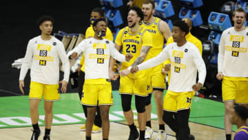 Mar 22, 2021; Indianapolis, Indiana, USA; The Michigan Wolverines celebrates after the game in the second round of the 2021 NCAA Tournament against the Louisiana State Tigers at Lucas Oil Stadium. Mandatory Credit: Joshua Bickel-USA TODAY Sports
