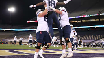 SEATTLE, WASHINGTON - NOVEMBER 21: Ma'jon Wright #18 of the Arizona Wildcats celebrates his 11-yard touchdown against the Washington Huskies in the fourth quarter at Husky Stadium on November 21, 2020 in Seattle, Washington. (Photo by Abbie Parr/Getty Images)