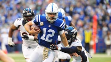 Nov 8, 2015; Indianapolis, IN, USA; Indianapolis Colts quarterback Andrew Luck (12) runs out of the pocket in the first half against the Denver Broncos at Lucas Oil Stadium. Mandatory Credit: Thomas J. Russo-USA TODAY Sports