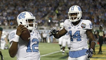 Dec 29, 2015; Orlando, FL, USA; North Carolina Tar Heels quarterback Marquise Williams (12) and wide receiver Quinshad Davis (14) celebrate a touchdown during the second half of a football game at Florida Citrus Bowl. Baylor won 49-38. Mandatory Credit: Reinhold Matay-USA TODAY Sports