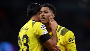 Jude Bellingham and Emre of Borussia Dortmund. (Photo by Alex Pantling/Getty Images)