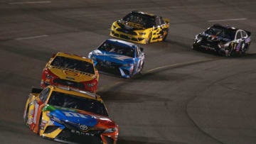 RICHMOND, VA - APRIL 13: Kyle Busch, driver of the #18 M&M's Toyota, leads a pack of cars during the Monster Energy NASCAR Cup Series Toyota Owners 400 at Richmond Raceway on April 13, 2019 in Richmond, Virginia. (Photo by Sean Gardner/Getty Images)