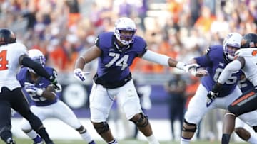 Oct 18, 2014; Fort Worth, TX, USA; TCU Horned Frogs tackle Halapoulivaati Vaitai (74) in action against the Oklahoma State Cowboys at Amon G. Carter Stadium. Mandatory Credit: Matthew Emmons-USA TODAY Sports