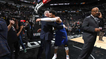 SAN ANTONIO, TX - APRIL 20: Head Coach Michael Malone and Jamal Murray #27 of the Denver Nuggets hug Game Four of Round One against the San Antonio Spurs during the 2019 NBA Playoffs on April 20, 2019 at the AT&T Center in San Antonio, Texas. NOTE TO USER: User expressly acknowledges and agrees that, by downloading and/or using this photograph, user is consenting to the terms and conditions of the Getty Images License Agreement. Mandatory Copyright Notice: Copyright 2019 NBAE (Photo by Garrett Ellwood/NBAE via Getty Images)