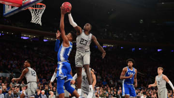 NEW YORK, NEW YORK - NOVEMBER 22: Josh LeBlanc #23 of the Georgetown Hoyas blocks Javin DeLaurier #12 of the Duke Blue Devils shot during the second half of their game at Madison Square Garden on November 22, 2019 in New York City. (Photo by Emilee Chinn/Getty Images)