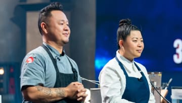 Contestants Jet Tila and Mei Lin watch the Randomizer for Battle 2, West Finale, as seen on Tournament of Champions, Season 4.