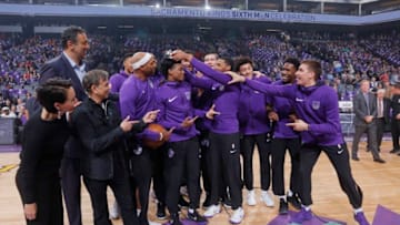 SACRAMENTO, CA - APRIL 11: Garrett Temple #17 of the Sacramento Kings receives and places the annual Oscar Robertson Triple- Double Award on the head of teammate De'Aaron Fox #5 prior to the game against the Houston Rockets on April 11, 2018 at Golden 1 Center in Sacramento, California. NOTE TO USER: User expressly acknowledges and agrees that, by downloading and or using this photograph, User is consenting to the terms and conditions of the Getty Images Agreement. Mandatory Copyright Notice: Copyright 2018 NBAE (Photo by Rocky Widner/NBAE via Getty Images)