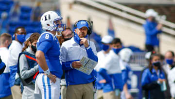 Duke football head coach David Cutcliffe and quarterback Chase Brice (Photo by Nell Redmond-Pool/Getty Images)