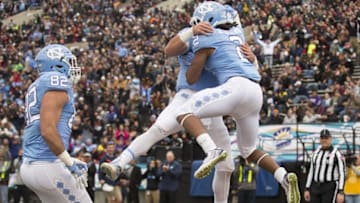Dec 30, 2016; El Paso, TX, USA; North Carolina Tar Heels running back Jordon Brown (2) celebrates with quarterback Mitch Trubisky (10) after scoring a touchdown against the Stanford Cardinal defense at Sun Bowl Stadium. Mandatory Credit: Ivan Pierre Aguirre-USA TODAY Sports