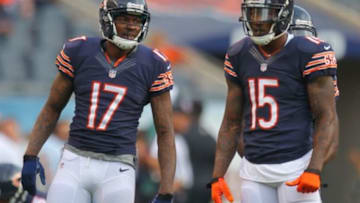 Aug 8, 2014; Chicago, IL, USA; Chicago Bears wide receiver Alshon Jeffery (L) and wide receiver Brandon Marshall (R) talk prior to a preseason game against the Philadelphia Eagles at Soldier Field. Mandatory Credit: Dennis Wierzbicki-USA TODAY Sports