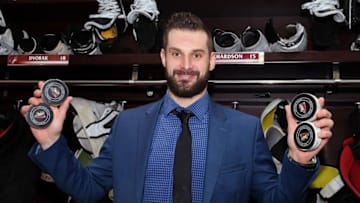 GLENDALE, AZ - FEBRUARY 28: Brad Richardson #15 of the Arizona Coyotes holds the pucks from his four goals against the Vancouver Canucks following a 5-2 victory at Gila River Arena on February 28, 2019 in Glendale, Arizona. (Photo by Norm Hall/NHLI via Getty Images)