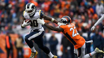 DENVER, CO - OCTOBER 14: Running back Todd Gurley #30 of the Los Angeles Rams rushes against defensive back Tramaine Brock #22 of the Denver Broncos in the third quarter of a game at Broncos Stadium at Mile High on October 14, 2018 in Denver, Colorado. (Photo by Dustin Bradford/Getty Images)