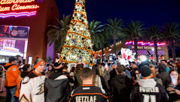IRVINE, CA - NOVEMBER 25: Ducks fans gather around a 35-foot Christmas tree during the Duck the Halls: Watch Party at the Edwards Theater Courtyard at The Market Place in Irvine.///ADDITIONAL INFORMATION: i.1125.duckslighting ?ê 11/25/15 ?ê LEONARD ORTIZ, ORANGE COUNTY REGISTER - 10.Slug goes here.lo.jpg - "Duck the Halls" tree lighting, followed by an Anaheim Ducks watch party, is 5-9 p.m. Wednesday in the Edwards Theater courtyard at the Irvine Market Place center. Three 35-foot trees, inspired by the hockey team, will be lit before the 6 p.m. game. The MC/hosts will be former Ducks? goalie Guy Hebert (Photo by Leonard Ortiz/Digital First Media/Orange County Register via Getty Images)