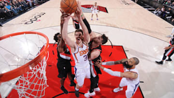 PORTLAND, OR - JANUARY 16: Dragan Bender #35 of the Phoenix Suns dunks against the Portland Trail Blazers on January 16, 2018 at the Moda Center in Portland, Oregon. NOTE TO USER: User expressly acknowledges and agrees that, by downloading and or using this Photograph, user is consenting to the terms and conditions of the Getty Images License Agreement. Mandatory Copyright Notice: Copyright 2018 NBAE (Photo by Sam Forencich/NBAE via Getty Images)