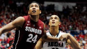 Mar 2, 2014; Tucson, AZ, USA; Stanford Cardinal forward Josh Huestis (24) and Arizona Wildcats guard Nick Johnson (13) battle for positioning during the second half at McKale Center. Arizona won 79-66. Mandatory Credit: Casey Sapio-USA TODAY Sports