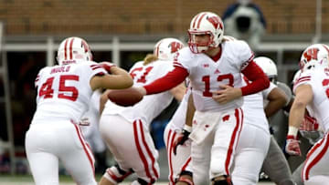 Oct 24, 2015; Champaign, IL, USA; Wisconsin Badgers quarterback Bart Houston (13) hands off the football to running back Alec Ingold (45) against the Illinois Fighting Illini at Memorial Stadium. Mandatory Credit: Mike Granse-USA TODAY Sports