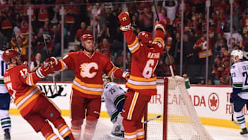 Jan 7, 2017; Calgary, Alberta, CAN; Calgary Flames center Matt Stajan (18) celebrates his first period goal with right wing Garnet Hathaway (64) against the Vancouver Canucks at Scotiabank Saddledome. Mandatory Credit: Candice Ward-USA TODAY Sports