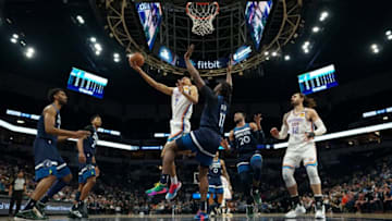January 13: OKC Thunder forward Darius Bazley (7) shot while Minnesota Timberwolves center Naz Reid (11) defended in the first half. (Photo by Jeff Wheeler/Star Tribune via Getty Images)