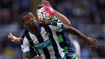 Newcastle United's Dutch midfielder Georginio Wijnaldum (L) vies with Swansea City's Spanish defender Angel Rangel during the English Premier League football match between Newcastle United and Swansea City at St James' Park in Newcastle-upon-Tyne, north east England on April 16, 2016. / AFP / Scott Heppell (Photo credit should read SCOTT HEPPELL/AFP/Getty Images)