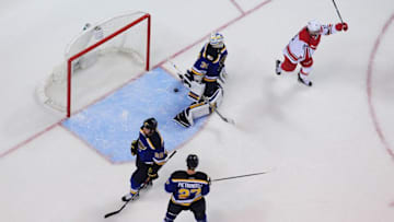 Jan 5, 2017; St. Louis, MO, USA; Carolina Hurricanes center Derek Ryan (33) celebrates after teammate left wing Jeff Skinner (not pictured) scored against St. Louis Blues goalie Jake Allen (34) as center Kyle Brodziak (28) and defenseman Kevin Shattenkirk (22) look on during the third period at Scottrade Center. The Hurricanes won 4-2. Mandatory Credit: Jeff Curry-USA TODAY Sports