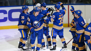 BUFFALO, NEW YORK - OCTOBER 16: Buffalo Sabres players celebrate after a win against the Arizona Coyotes at KeyBank Center on October 16, 2021 in Buffalo, New York. (Photo by Joshua Bessex/Getty Images)