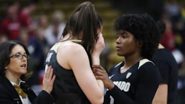 BOULDER, COLORADO - FEBRUARY 16: Jaylyn Sherrod #1 consoles teammate Emma Clarke #3 of the Colorado Buffaloes after a buzzer beating-half court shot from Kiana Williams #23 of the Stanford Cardinal in a game between the Stanford Cardinal and the Colorado Buffaloes at Coors Events Center on February 16, 2020 in Boulder, Colorado. The Cardinal defeated the Buffaloes 69-66. (Photo by Lizzy Barrett/Getty Images)