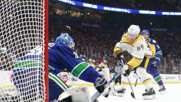 VANCOUVER, BC - NOVEMBER 12: Thatcher Demko #35 of the Vancouver Canucks makes a save off the shot of Mikael Granlund #64 of the Nashville Predators during their NHL game at Rogers Arena November 12, 2019 in Vancouver, British Columbia, Canada. (Photo by Jeff Vinnick/NHLI via Getty Images)