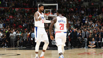LOS ANGELES, CA - NOVEMBER 20: Paul George #13, and Patrick Beverley #21 of the LA Clippers react to a play against the Boston Celtics on November 20, 2019 at STAPLES Center in Los Angeles, California. NOTE TO USER: User expressly acknowledges and agrees that, by downloading and/or using this Photograph, user is consenting to the terms and conditions of the Getty Images License Agreement. Mandatory Copyright Notice: Copyright 2019 NBAE (Photo by Andrew D. Bernstein/NBAE via Getty Images)