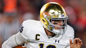 ATHENS, GA - SEPTEMBER 21: Notre Dame Fighting Irish quarterback Ian Book (12) scrambles during the second half of the Notre Dame Fighting Irish v Georgia Bulldogs game on September 21, 2019 at Sanford Stadium in Athens, GA.(Photo by Todd Kirkland/Icon Sportswire via Getty Images)