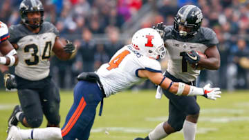 WEST LAFAYETTE, IN - NOVEMBER 04: D.J. Knox #1 of the Purdue Boilermakers runs the ball as Bennett Williams #4 of the Illinois Fighting Illini tries to make the tackle at Ross-Ade Stadium on November 4, 2017 in West Lafayette, Indiana. (Photo by Michael Hickey/Getty Images)