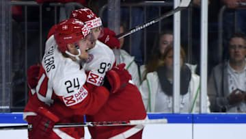 Denmark´s Peter Regin (R) and Nikolaj Ehlers celebrate after the IIHF Ice Hockey World Championships first round match between Germany and Denmark in Cologne, western Germany on May 12, 2017. / AFP PHOTO / PATRIK STOLLARZ (Photo credit should read PATRIK STOLLARZ/AFP via Getty Images)