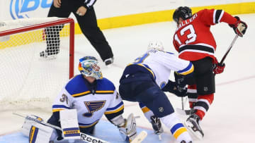 Nov 10, 2015; Newark, NJ, USA; St. Louis Blues goalie Jake Allen (34) makes a save on New Jersey Devils left wing Mike Cammalleri (13) during the third period at Prudential Center. The Blues defeated the Devils 2-0. Mandatory Credit: Ed Mulholland-USA TODAY Sports