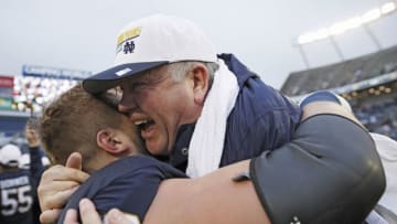 3ORLANDO, FL - JANUARY 01: Head coach Brian Kelly of the Notre Dame Fighting Irish is lifted up by Hunter Bivin #70 following the Citrus Bowl against the LSU Tigers on January 1, 2018 in Orlando, Florida. Notre Dame won 21-17. (Photo by Joe Robbins/Getty Images)