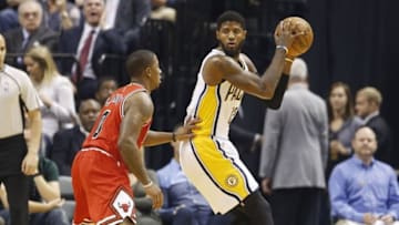 Nov 5, 2016; Indianapolis, IN, USA; Indiana Pacers forward Paul George (13) is guarded by Chicago Bulls guard Isaiah Canaan (0) at Bankers Life Fieldhouse. Mandatory Credit: Brian Spurlock-USA TODAY Sports
