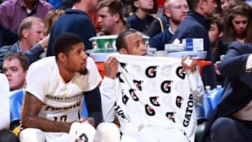 Jan 2, 2016; Indianapolis, IN, USA; Indiana Pacers forward Paul George (13) and guard Monta Ellis (11) watch from the bench during a game against the Detroit Pistons at Bankers Life Fieldhouse. Indiana defeats Detroit 94-82. Mandatory Credit: Brian Spurlock-USA TODAY Sports