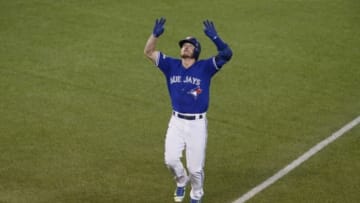 Oct 19, 2015; Toronto, Ontario, CAN; Toronto Blue Jays third baseman Josh Donaldson (20) celebrates after hitting a two run home run against the Kansas City Royals during the third inning in game three of the ALCS at Rogers Centre. Mandatory Credit: John E. Sokolowski-USA TODAY Sports