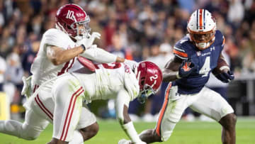 Auburn football running back Tank Bigsby (4) runs the ball during the Iron Bowl at Jordan-Hare Stadium in Auburn, Ala., on Saturday, Nov. 27, 2021. Alabama Crimson Tide defeated Auburn Tigers 24-22 in 4OT.