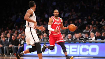 Feb 10, 2016; Brooklyn, NY, USA; Memphis Grizzlies point guard Mike Conley (11) controls the ball against Brooklyn Nets power forward Thaddeus Young (30) during the first quarter at Barclays Center. Mandatory Credit: Brad Penner-USA TODAY Sports