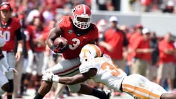 Sep 27, 2014; Athens, GA, USA; Georgia Bulldogs running back Todd Gurley (3) runs past Tennessee Volunteers linebacker Jalen Reeves-Maybin (34) during the first half at Sanford Stadium. Mandatory Credit: Dale Zanine-USA TODAY Sports