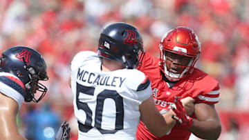 HOUSTON, TX - SEPTEMBER 8: Josh McCauley #50 of the Arizona Wildcats blocks Ed Oliver #10 of the Houston Cougars in the first quarter at TDECU Stadium on September 8, 2018 in Houston, Texas. (Photo by Thomas B. Shea/Getty Images)
