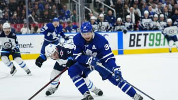 Toronto Maple Leafs, Auston Matthews (34); Winnipeg Jets, Dylan DeMelo (2). Mandatory Credit: John E. Sokolowski-USA TODAY Sports