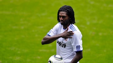 New Real Madrid's Togolsese striker Emmanuel Adebayor gestures as he poses during his presentation to medias on January 27, 2011 at the Santiago Bernabeu stadium in Madrid. The 26-year-old has been brought in to add urgently needed firepower after Argentinian striker Gonzalo Higuain underwent surgery to fix a slipped disc earlier this month and is expected to be out of action for another four months. AFP PHOTO/ PIERRE-PHILIPPE MARCOU (Photo credit should read PIERRE-PHILIPPE MARCOU/AFP via Getty Images)