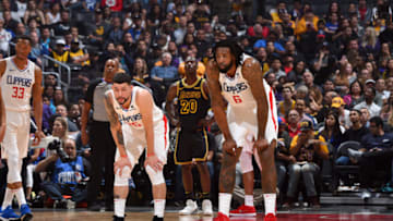 LOS ANGELES, CA - APRIL 11: Austin Rivers #25 and DeAndre Jordan #6 of the LA Clippers look on during the game against the Los Angeles Lakers on April 11, 2018 at STAPLES Center in Los Angeles, California. NOTE TO USER: User expressly acknowledges and agrees that, by downloading and/or using this photograph, user is consenting to the terms and conditions of the Getty Images License Agreement. Mandatory Copyright Notice: Copyright 2018 NBAE (Photo by Adam Pantozzi/NBAE via Getty Images)