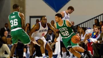 Oct 11, 2013; Newark, DE, USA; Boston Celtics guard Chris Babb (52) is defended by Philadelphia 76ers guard James Anderson (9) during the fourth quarter at Bob Carpenter Sports Convocation Center. The Sixers defeated the Celtics 97-85. Mandatory Credit: Howard Smith-USA TODAY Sports