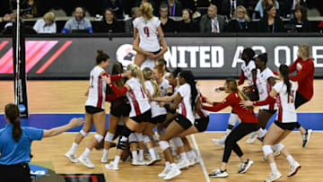 Dec 15, 2022; Omaha, Nebraska, US; The Louisville Cardinals celebrate the win against the Pittsburg Panthers in the semi-final match at CHI Health Center. Mandatory Credit: Steven Branscombe-USA TODAY Sports