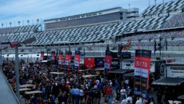 Jan 30, 2016; Daytona Beach, FL, USA; Fans walk the garage area before the Rolex 24 at Daytona International Speedway. Mandatory Credit: Jasen Vinlove-USA TODAY Sports
