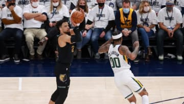 May 23, 2021; Salt Lake City, Utah, USA; Memphis Grizzlies forward Dillon Brooks (24) shoots the ball over Utah Jazz guard Jordan Clarkson (00) during the first quarter at Vivint Arena. Mandatory Credit: Chris Nicoll-USA TODAY Sports