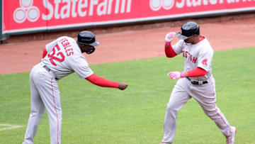 May 9, 2021; Baltimore, Maryland, USA; Boston Red Sox third baseman Rafael Devers is congratulated by third base coach Carlos Febles (52) after hitting a home run in the second inning against the Baltimore Orioles at Oriole Park at Camden Yards. Mandatory Credit: Evan Habeeb-USA TODAY Sports